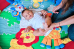 smiling-teacher-and-multicultural-preschoolers-sit-2023-11-27-05-19-51-utc-scaled-r3vems4lvwse854sn6aiuyiggc0x1x6gh21rzbco7w