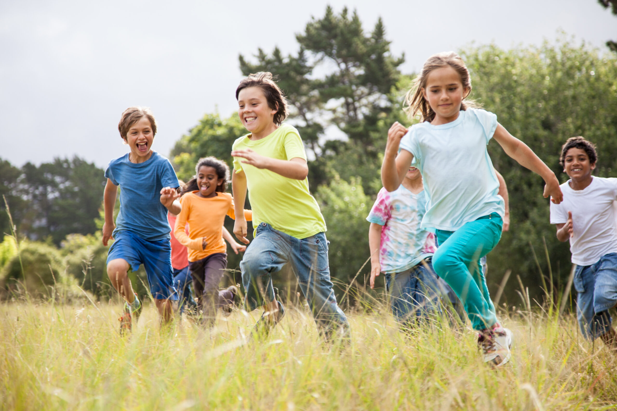 Children running together in a park